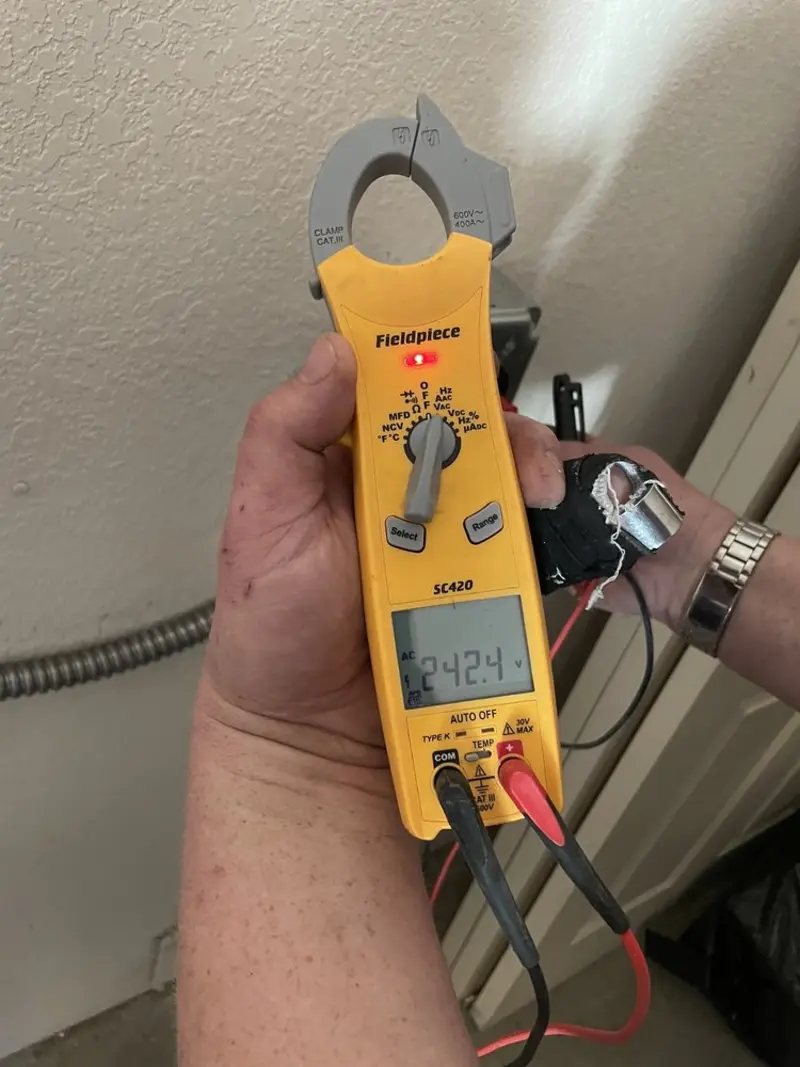 Voltage testing with clamp meter during Generator Installation in Monroe